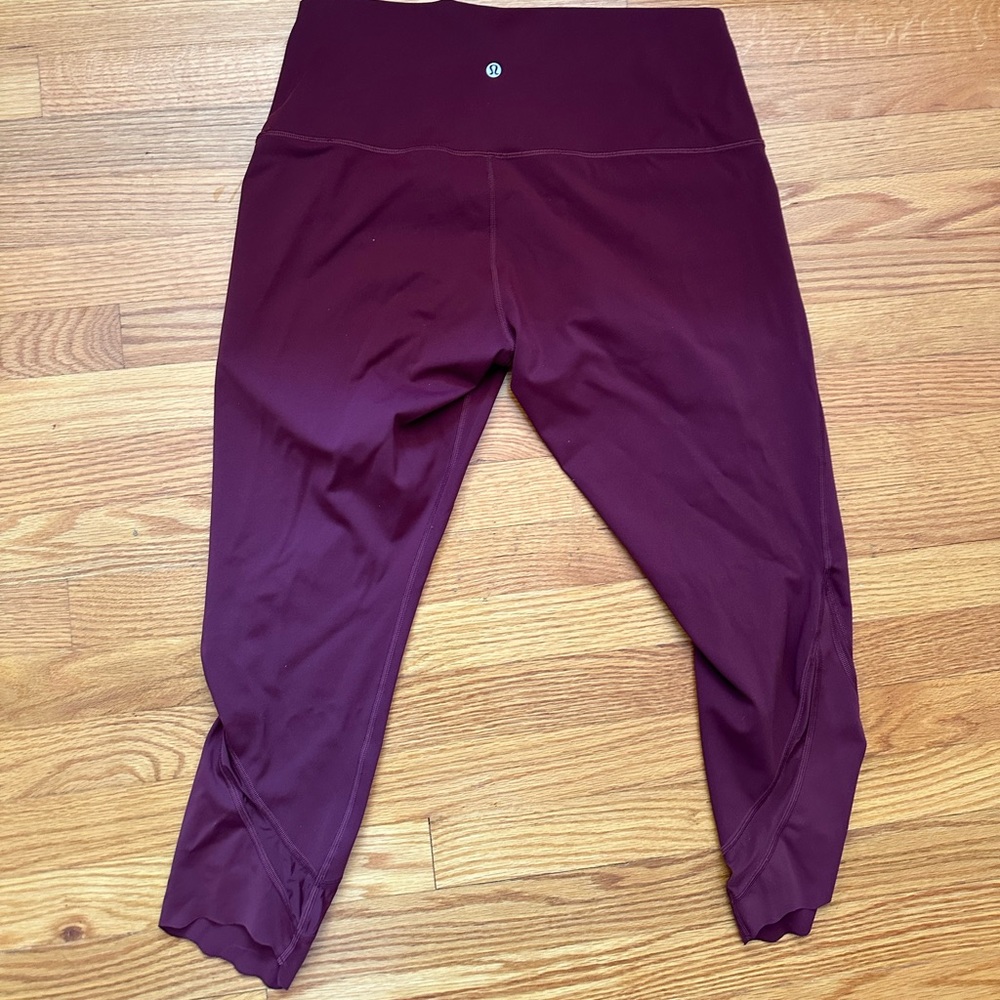 Woman’s maroon lululemon leggings